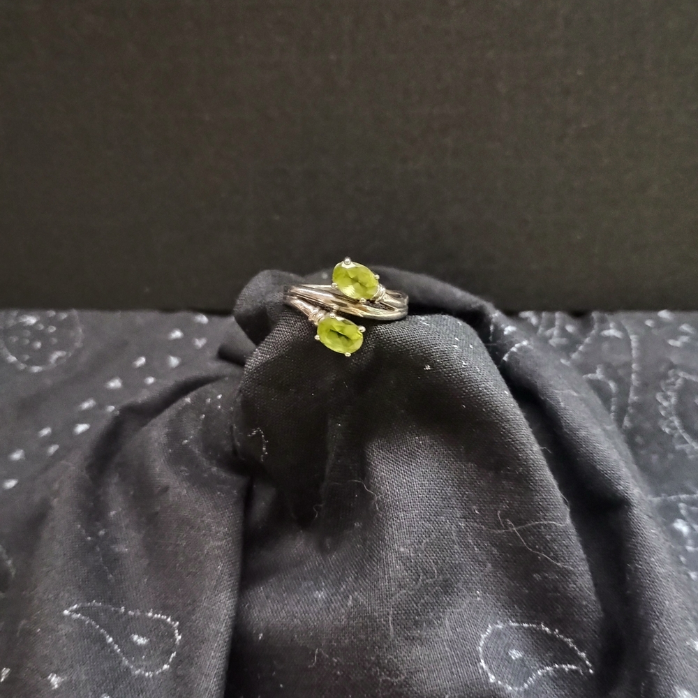 Elegant Silver Ring with Green Peridot Gemstones